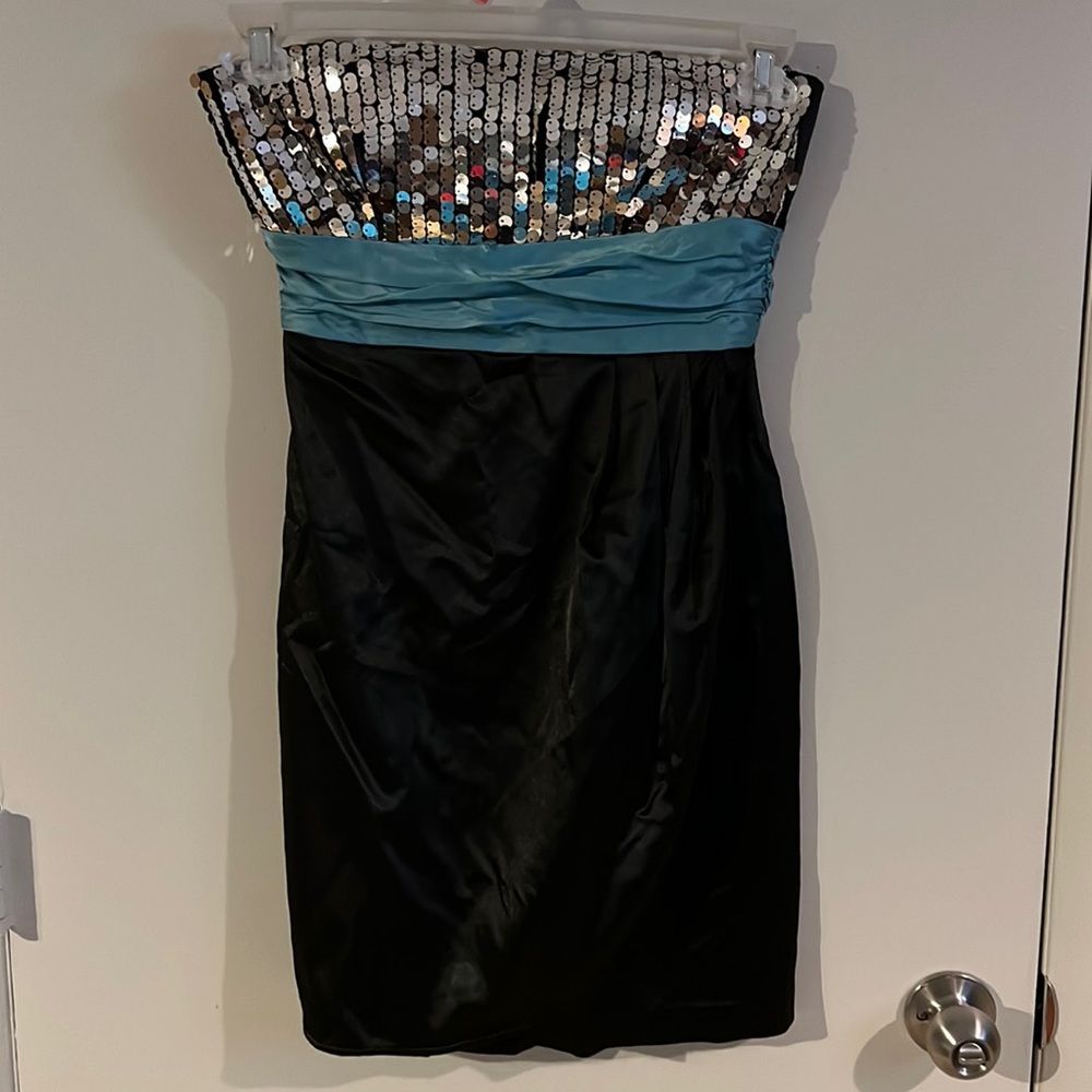 Black dress with teal and silver sequins on bodice.